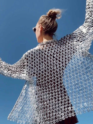 woman dancing wearing silver jacket made of pop tabs - escama studio